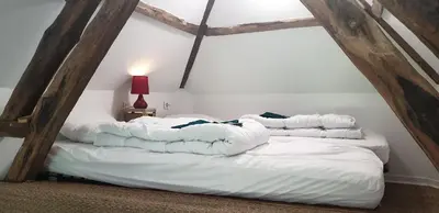 Un ou plusieurs lits dans un hébergement de l'établissement La Petite Eole - Déco 70's, Entre Rouen et Dieppe
