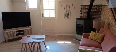 Télévision ou salle de divertissement dans l'établissement Gite la pause picarde