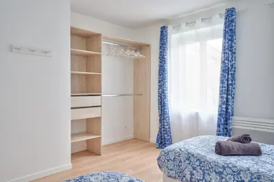 Un ou plusieurs lits dans un hébergement de l'établissement Le Gabriel - Maison spacieuse et calme près de Paris