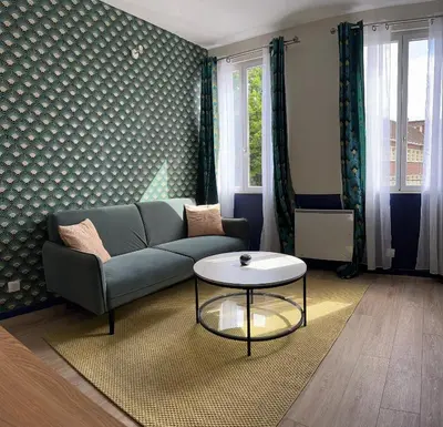 Coin salon dans l'établissement Appartement entier cosy