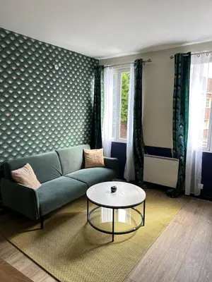 Coin salon dans l'établissement Appartement entier cosy