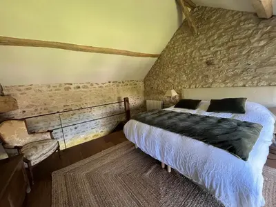 Un ou plusieurs lits dans un hébergement de l'établissement Le Clos des Songes