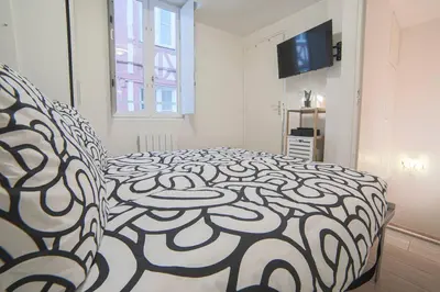 Un ou plusieurs lits dans un hébergement de l'établissement Charmant appartement en duplex au coeur de Rouen