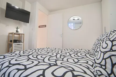 Un ou plusieurs lits dans un hébergement de l'établissement Charmant appartement en duplex au coeur de Rouen