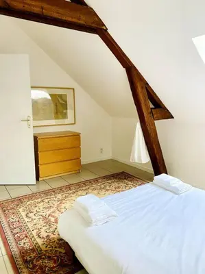 Un ou plusieurs lits dans un hébergement de l'établissement La Tsarine - Cottage - Château Le Bas Bleu