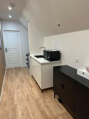 Cuisine ou kitchenette dans l'établissement Le Nid des Voyageurs - Chambre Paruline