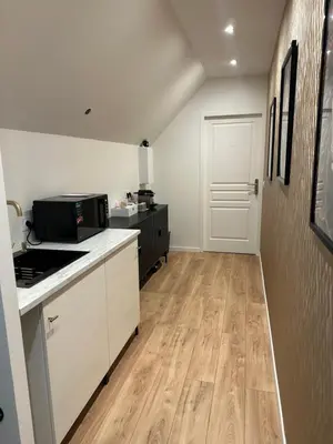 Cuisine ou kitchenette dans l'établissement Le Nid des Voyageurs - Chambre Paruline