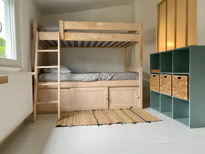 Un ou plusieurs lits dans un hébergement de l'établissement L Obione charmante maison de pêcheur rénovée proche mer avec patio extérieur