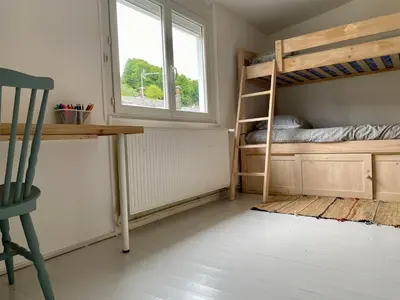 Un ou plusieurs lits dans un hébergement de l'établissement L Obione charmante maison de pêcheur rénovée proche mer avec patio extérieur