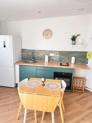 Cuisine ou kitchenette dans l'établissement La belle Iris