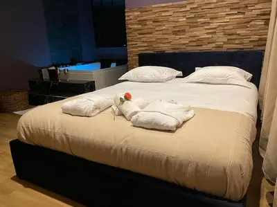 Un ou plusieurs lits dans un hébergement de l'établissement Le Cocon des Granges - Suite Sauna Jaccuzi SPA