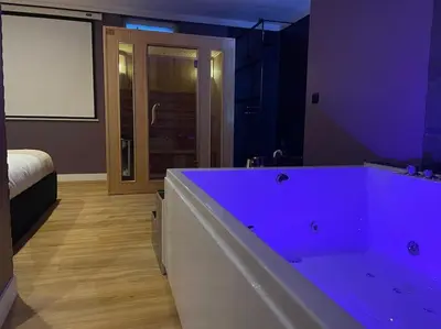 Un ou plusieurs lits dans un hébergement de l'établissement Le Cocon des Granges - Suite Sauna Jaccuzi SPA