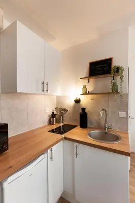 Cuisine ou kitchenette dans l'établissement L'escapade studio en Hypercentre Cathédrale