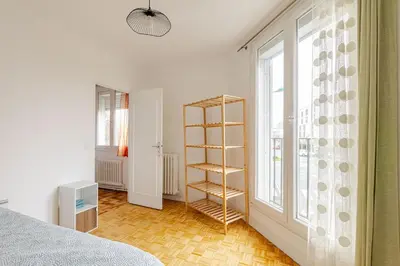 Un ou plusieurs lits dans un hébergement de l'établissement appartement proche paris et Roissy