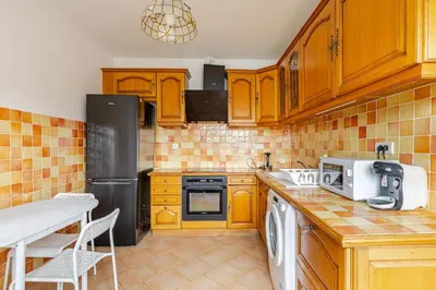 Cuisine ou kitchenette dans l'établissement appartement proche paris et Roissy