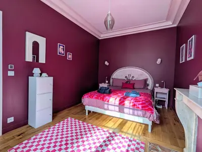 Un ou plusieurs lits dans un hébergement de l'établissement Pop Castle à Chantilly