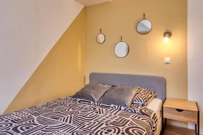 Un ou plusieurs lits dans un hébergement de l'établissement Appartement Rénové