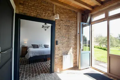 Un ou plusieurs lits dans un hébergement de l'établissement Orangerie du chateau
