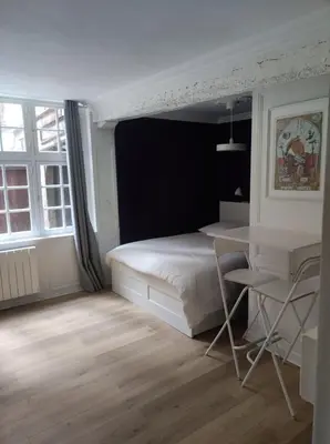 Un ou plusieurs lits dans un hébergement de l'établissement Rue Saint Romain - Cathédrale - cour