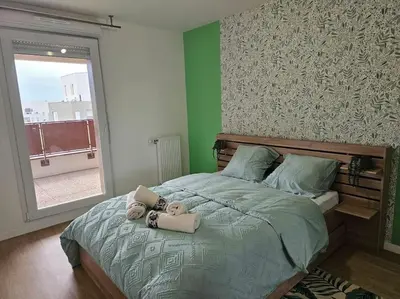 Un ou plusieurs lits dans un hébergement de l'établissement grand appartement 2 pièces en résidence