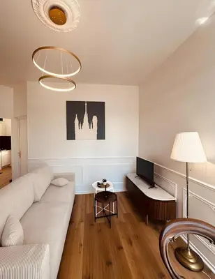 Télévision ou salle de divertissement dans l'établissement St Croix Appartement style Haussmannien lumineux 