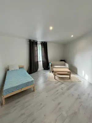 Un ou plusieurs lits dans un hébergement de l'établissement Maison à Mantes la jolie