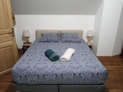 Un ou plusieurs lits dans un hébergement de l'établissement Grande Maison en bord de Seine