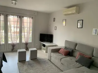 Coin salon dans l'établissement Appartement spacieux à Pierrelaye avec vue sur jardin, 83 m²