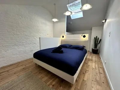 Un ou plusieurs lits dans un hébergement de l'établissement Gare Unique Duplex lumineux