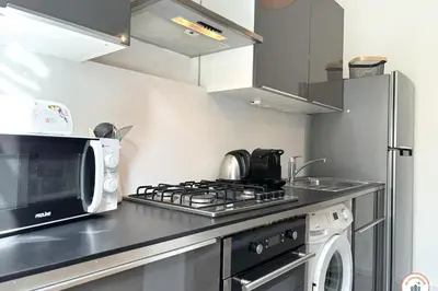 Cuisine ou kitchenette dans l'établissement Le Jeanne d'Arc - Place du Vieux Marché