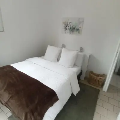 Un ou plusieurs lits dans un hébergement de l'établissement la maison au bord de l'eau