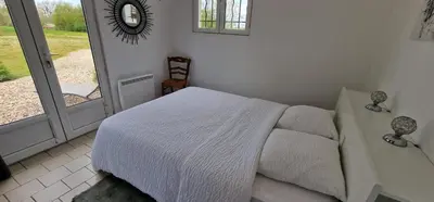 Un ou plusieurs lits dans un hébergement de l'établissement la maison au bord de l'eau