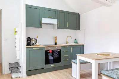 Cuisine ou kitchenette dans l'établissement Le Charmant Cormeillais
