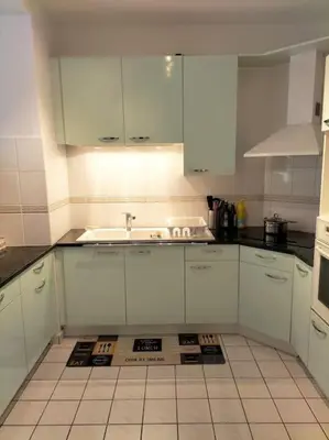Cuisine ou kitchenette dans l'établissement Cosy flat in Beauvais city center
