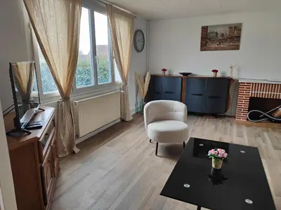 Coin salon dans l'établissement Le repère, 2 lits doubles - classé 2 étoiles