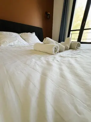 Un ou plusieurs lits dans un hébergement de l'établissement villa Konny studio rez-de-chaussée