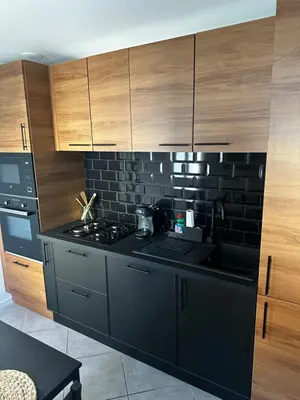 Cuisine ou kitchenette dans l'établissement La Perle charmante maison avec parking privé