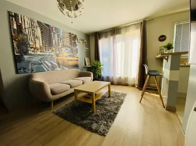 Cuisine ou kitchenette dans l'établissement Appartement cosy entre Paris & Normandie