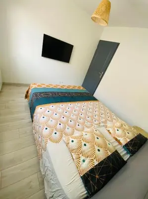 Un ou plusieurs lits dans un hébergement de l'établissement Appartement cosy entre Paris & Normandie