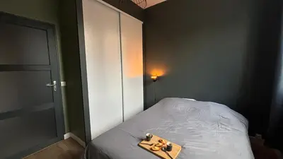 Un ou plusieurs lits dans un hébergement de l'établissement Appartement proche gare avec garage