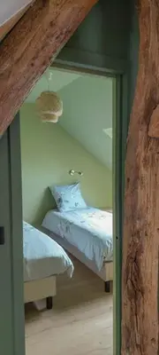 Un ou plusieurs lits dans un hébergement de l'établissement Le Cottage -Gîte de charme-