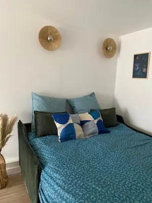 Un ou plusieurs lits dans un hébergement de l'établissement Bel appartement neuf proche de Paris