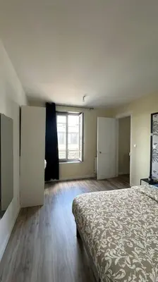 Un ou plusieurs lits dans un hébergement de l'établissement Appartement Cosy Clinique Mathilde