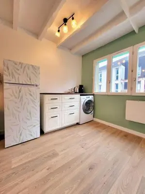 Cuisine ou kitchenette dans l'établissement La Vie en Rose