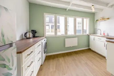Cuisine ou kitchenette dans l'établissement La Vie en Rose
