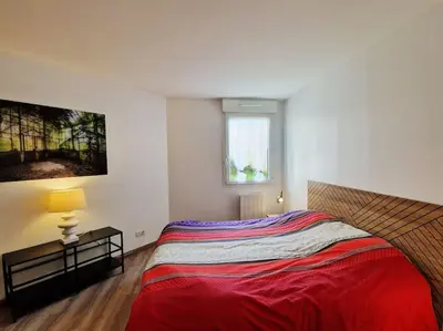 Un ou plusieurs lits dans un hébergement de l'établissement Votre cocon avec baignoire et Wifi à 15 min à pied du centre d'Amiens