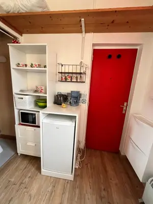 Cuisine ou kitchenette dans l'établissement Petit nid ensoleillé