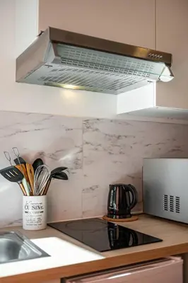Cuisine ou kitchenette dans l'établissement Charmante Maison à Rouen