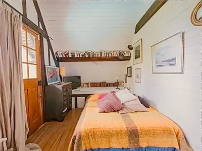 Un ou plusieurs lits dans un hébergement de l'établissement Maison au bord de la Seine
