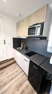 Cuisine ou kitchenette dans l'établissement Le Bohème 1er Étage